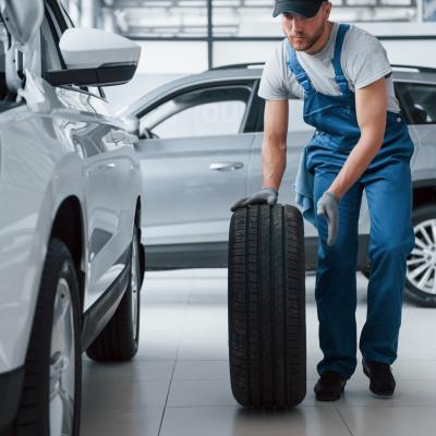 No Big Deal Mechanic Holding Tire Repair Garage Replacement Winter Summer Tires 146671 16134